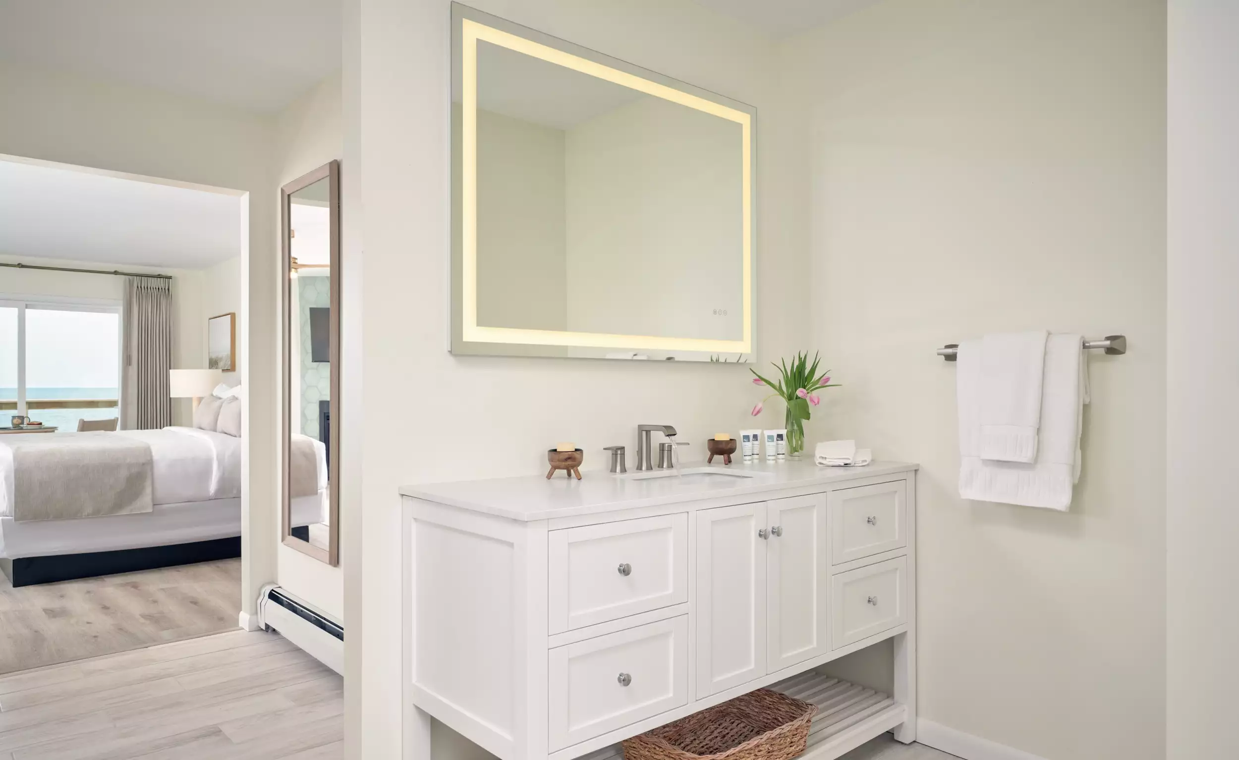 Spacious bathroom vanity with lighted makeup mirror